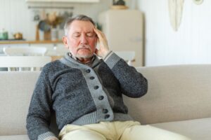 fatigued middle aged senior man