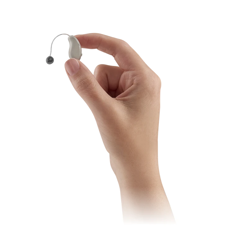 hand holding starkey hearing aid